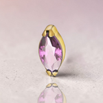 Instinct gold titanium labret with marquise-cut amethyst stone, internal threading.