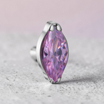 Instinct silver titanium labret piercing with a purple marquise-cut gemstone. Internal thread.
