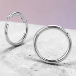 Instinct silver titanium clicker hoop earring for septum or daith piercing. Hinged closure.