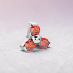 Instinct silver internally threaded labret with three orange gemstones in a trinity design.