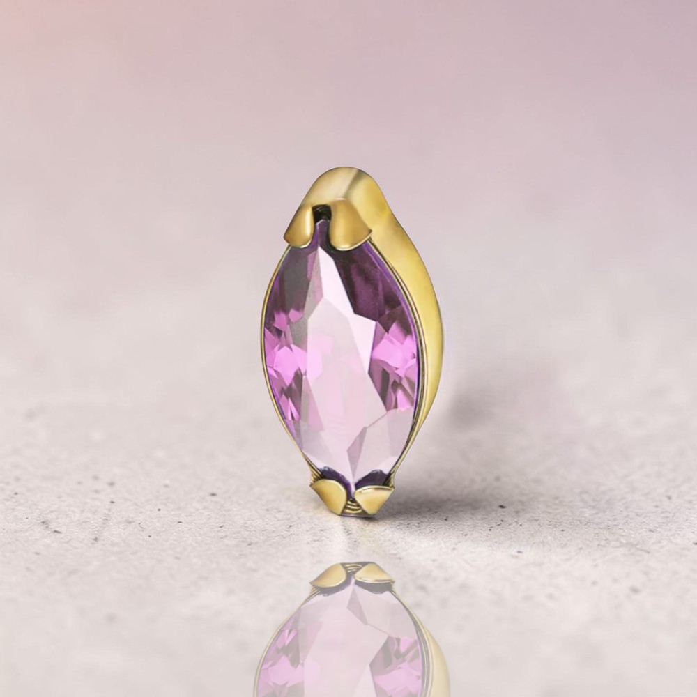 Instinct gold titanium labret with marquise-cut amethyst stone, internal threading.