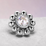 Instinct silver titanium labret piercing with internal thread, featuring a bubble flower design with a central clear crystal.