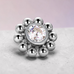 Instinct silver titanium labret piercing with internal thread, featuring a bubble flower design with a central clear crystal.
