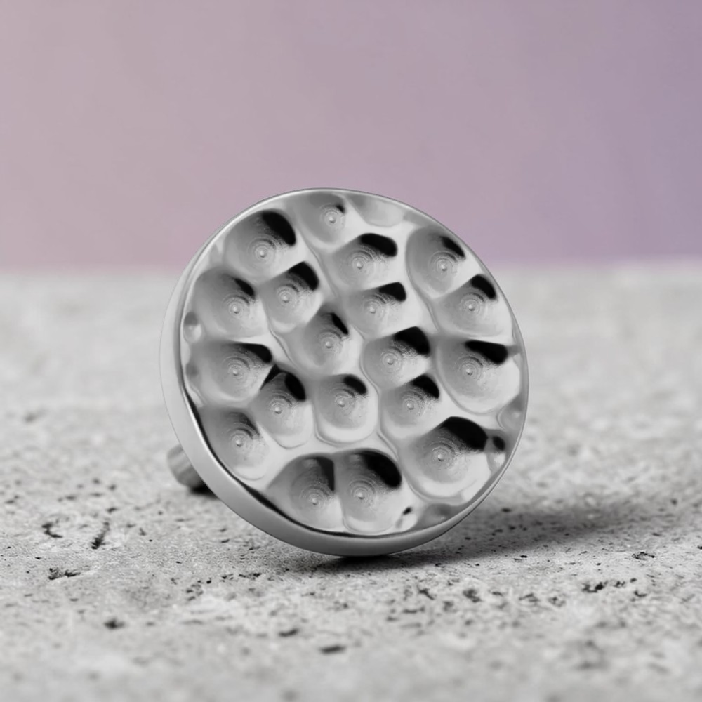 Instinct silver titanium labret piercing with a hammered disc top.