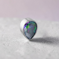 Instinct silver titanium labret with a faceted teardrop-shaped mystic gem. Internally threaded.