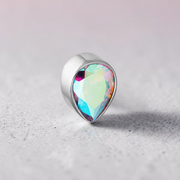 Instinct silver titanium labret piercing with iridescent teardrop gem. Internally threaded.