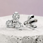 Instinct silver titanium labret piercing with internal thread and three clear crystals in a trinity design.