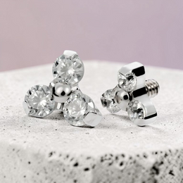 Instinct silver titanium labret piercing with internal thread and three clear crystals in a trinity design.