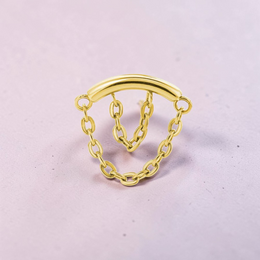 Instinct gold and silver titanium labret piercing with internal threading and double chain dangle.